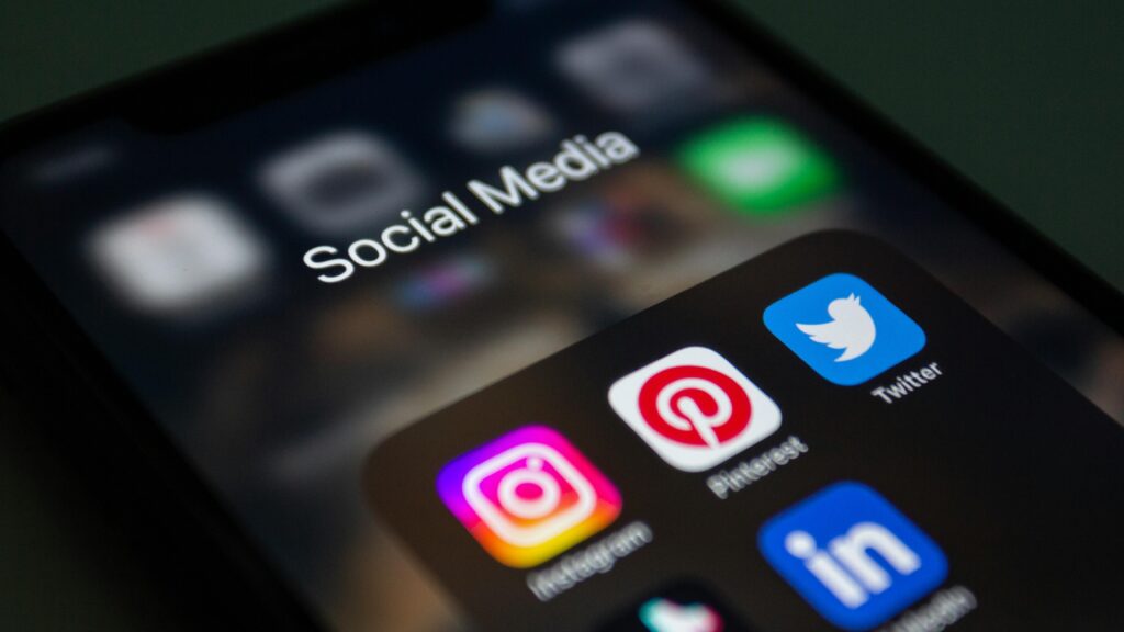 pexels-photo-15406294-15406294 A smartphone screen displaying popular social media applications like Instagram and Twitter.
